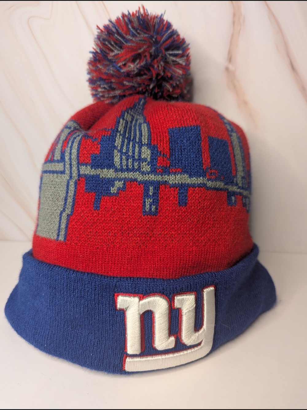 NFL Red, Blue & Gray Pom Beanie with Skyline and NY Giants Logo